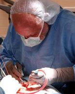 In this file photo from 2005, Dr. Zenko Hrynkiw performs back surgery at Baptist Montclair, now Trinity Medical Center. (Joe Songer/photo)