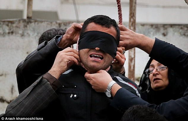 ncredible moment an Iranian killer is spared execution by his victim's mother